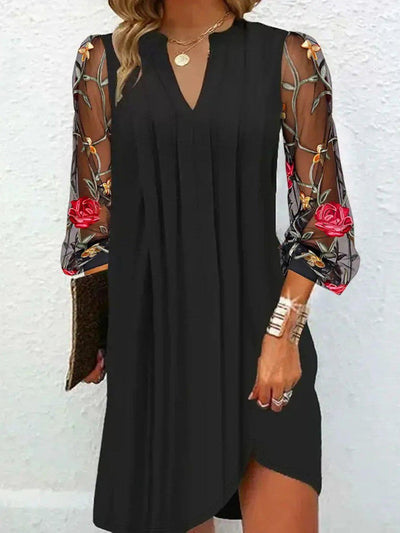 Elegantes Minikleid mit V-Ausschnitt und transparenten Ärmeln